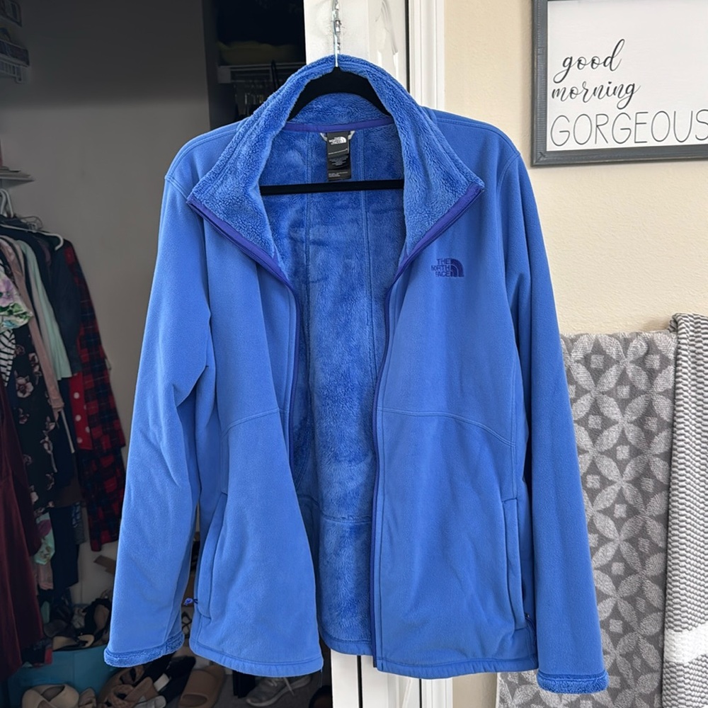 The North Face blue jacket with soft fur-like inside.